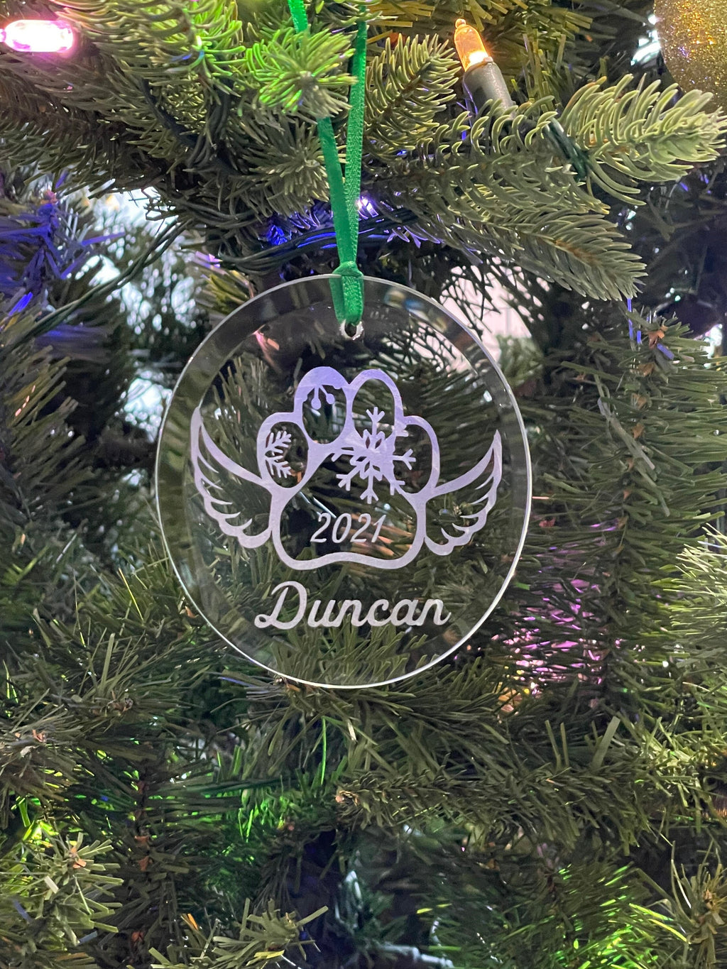 Dog memorial ornament on tree