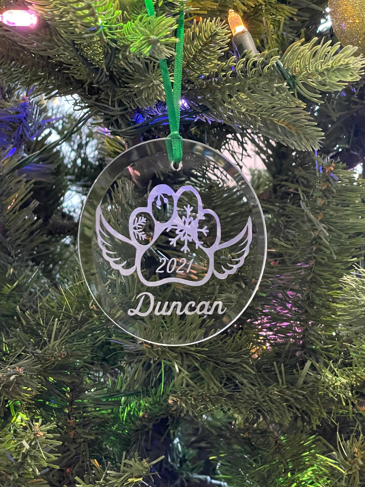 Dog memorial ornament on tree